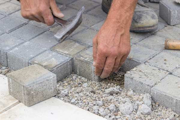 Man Installing A Stone Path